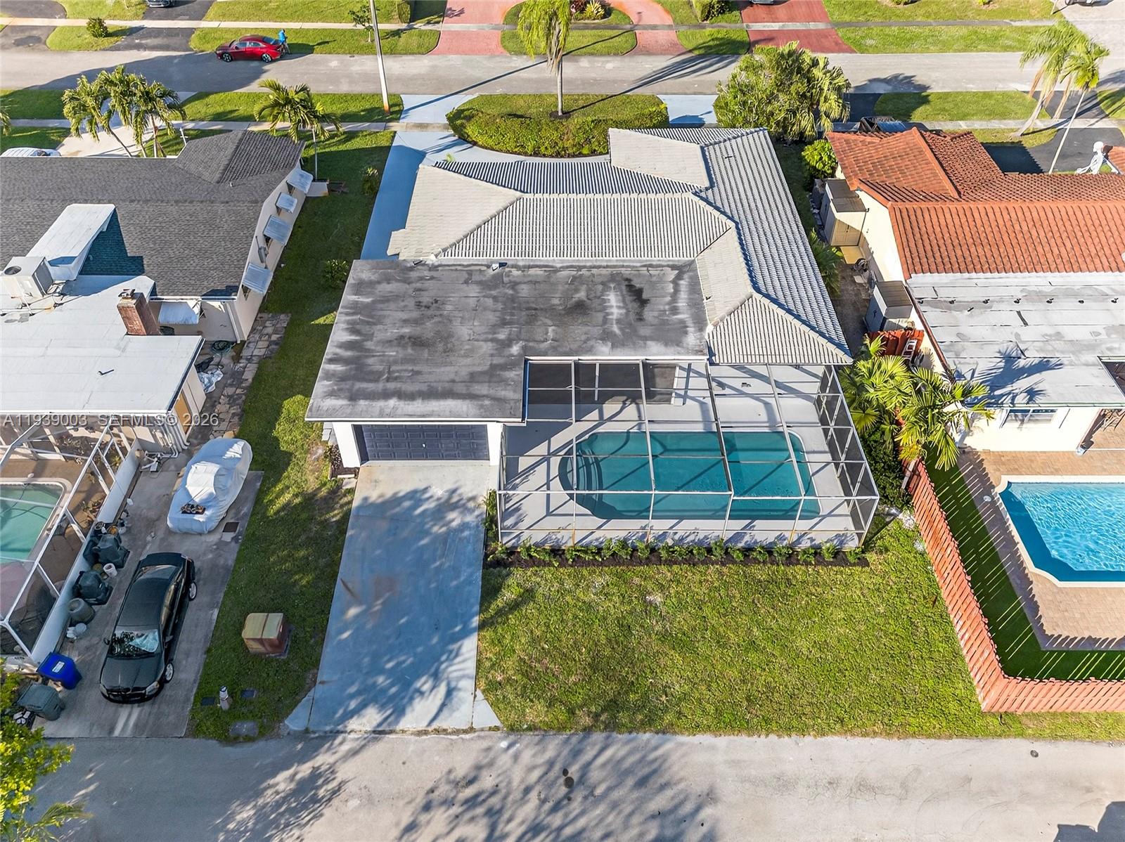 4712 Cleveland Street Hollywood, FL 33021 - Photo 48 of 49 an aerial view of a house with swimming pool