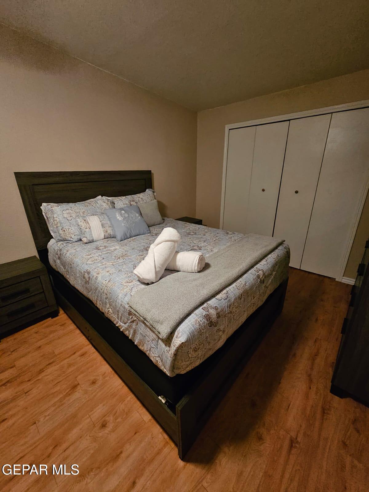 712 North Ochoa Street El Paso, TX 79902 - Photo 10 of 13 a bedroom with a bed and cabinet