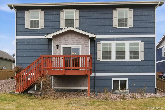 a backyard of a house with barbeque oven
