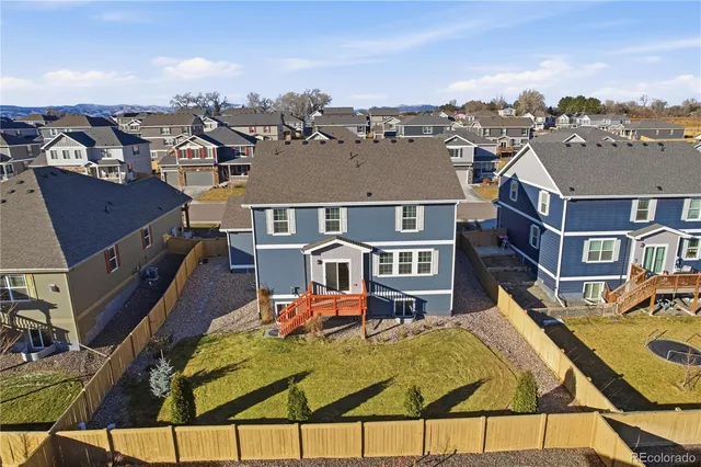 an aerial view of houses with outdoor space