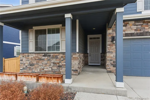 a view of front door of house with stairs