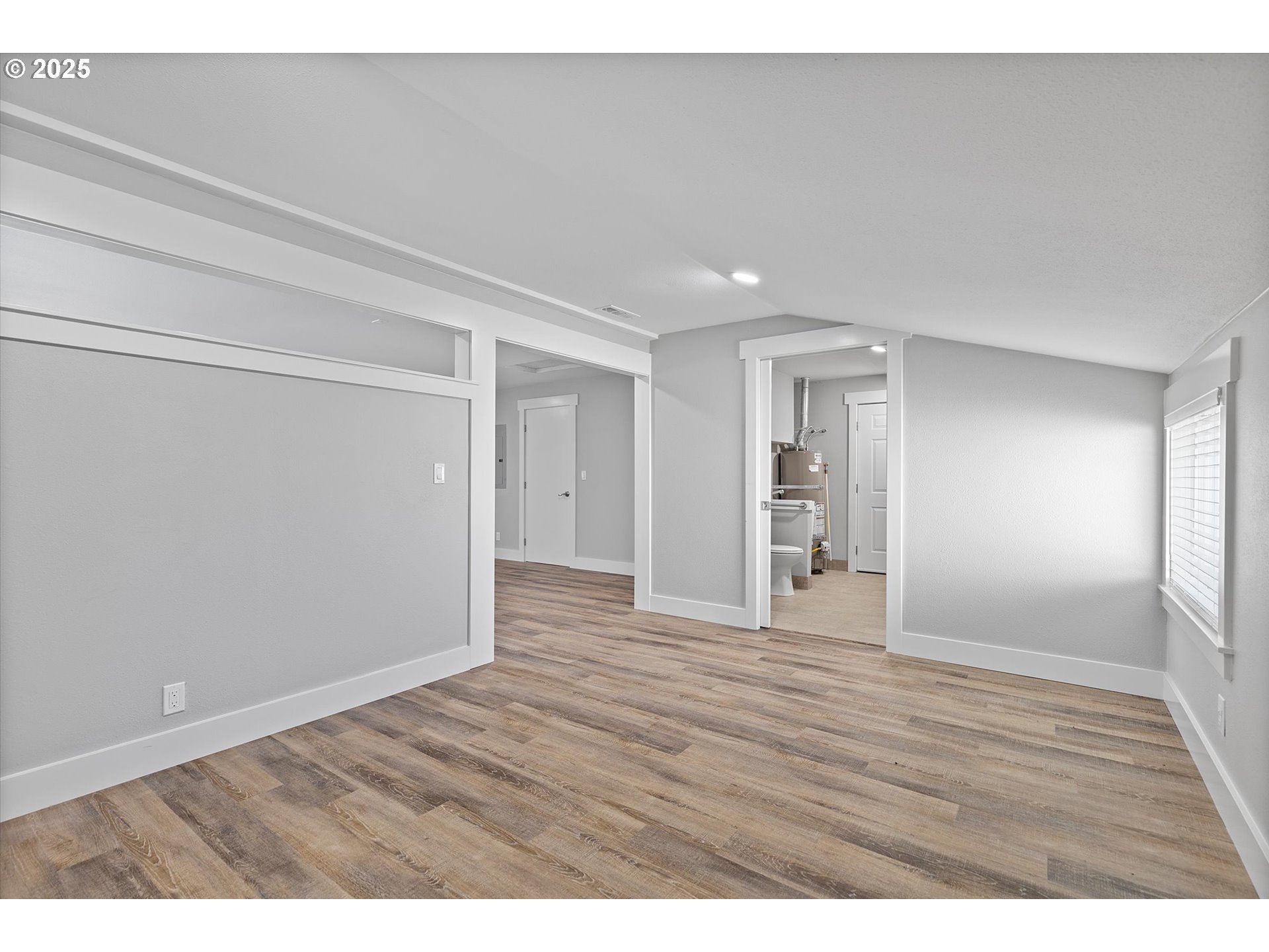 2997 Northeast Loop Drive Otis, OR 97368 - Photo 11 of 35 a view of an empty room with wooden floor and closet