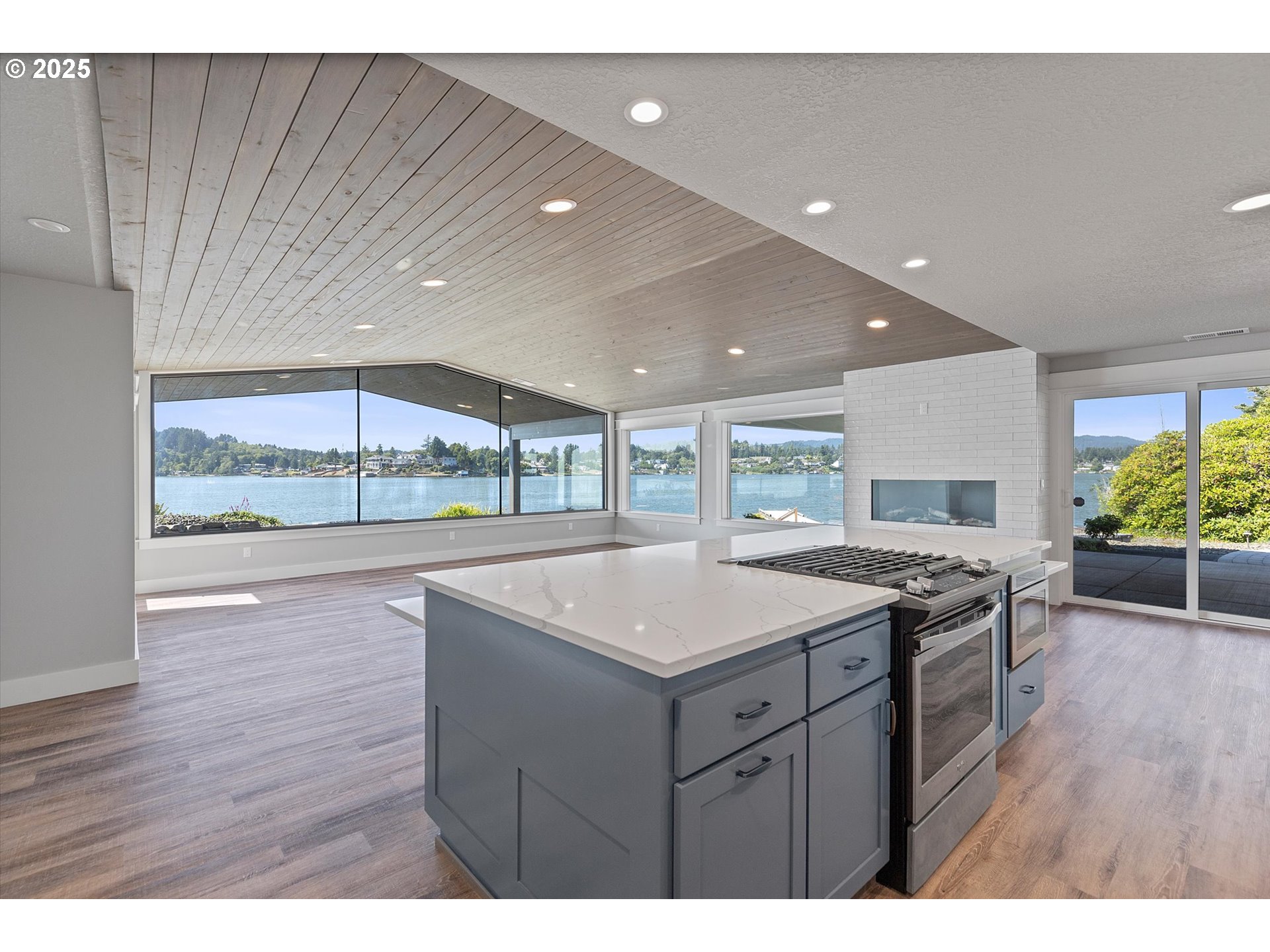 2997 Northeast Loop Drive Otis, OR 97368 - Photo 2 of 35 a kitchen with a sink and wooden floor