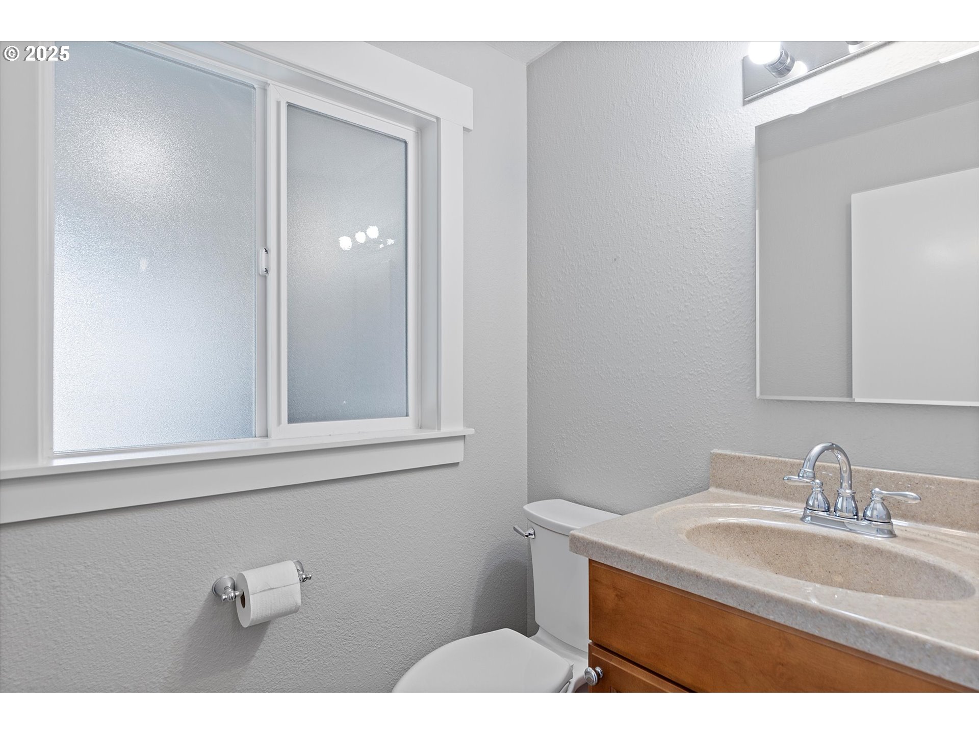 2997 Northeast Loop Drive Otis, OR 97368 - Photo 22 of 35 a bathroom with a sink vanity and mirror