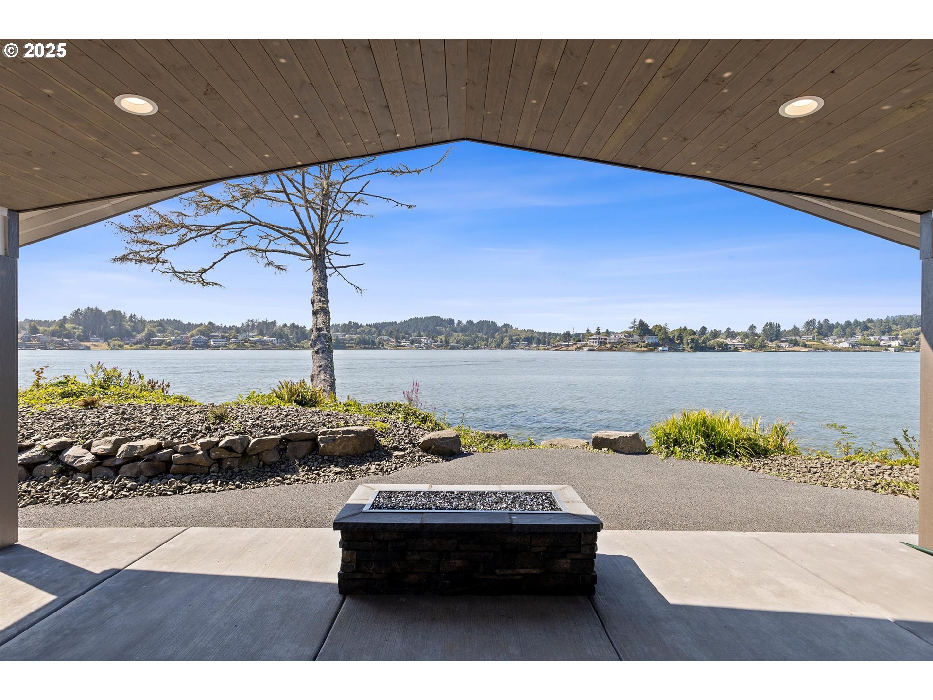 2997 Northeast Loop Drive Otis, OR 97368 - Photo 30 of 35 a terrace with outdoor seating and a potted plant