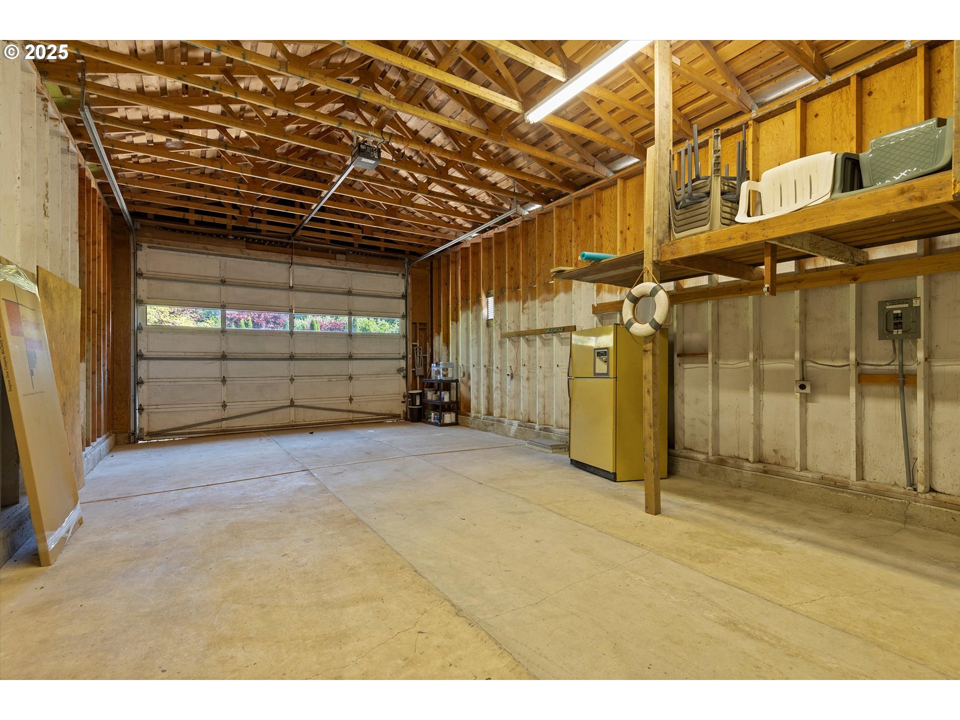 2997 Northeast Loop Drive Otis, OR 97368 - Photo 33 of 35 a view of a garage with wooden wall