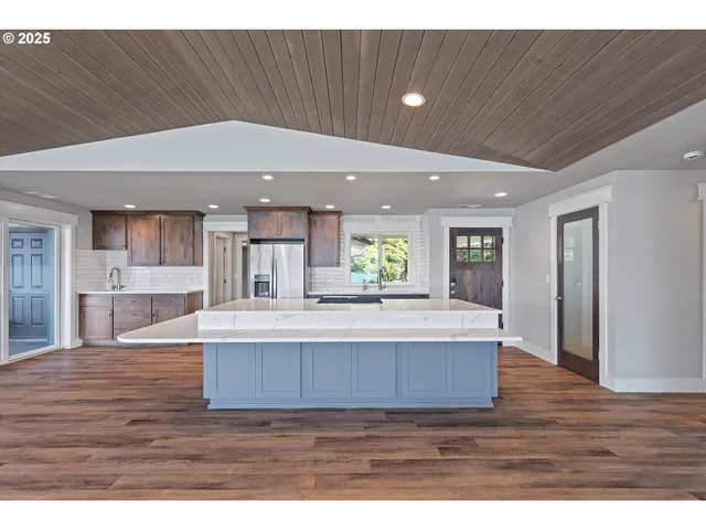 a view of kitchen with cabinets and wooden floor