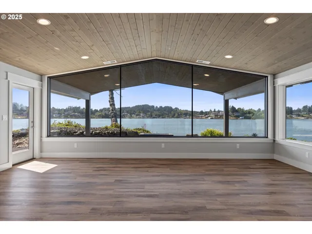 a view of an entryway with wooden floor