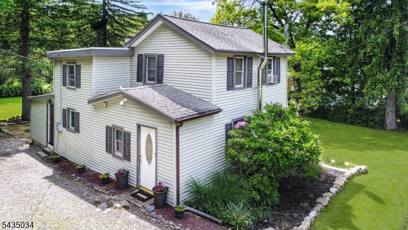 103 Petersburg Road Hackettstown, NJ 07840 - Photo 2 of 18 a view of a house with a yard plants and large tree