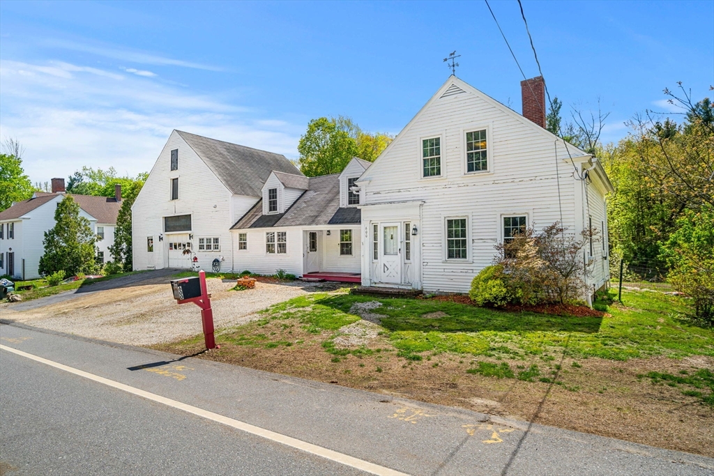 600 Main Street Ashby, MA 01431 - Photo 40 of 40 a view of a white house with a yard plants and large tree
