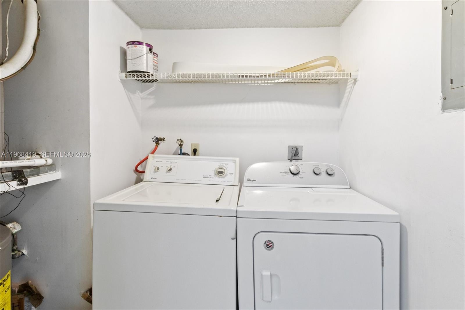 16400 Golf Club Road, Unit 104 Weston, FL 33326 - Photo 14 of 24 a utility room with dryer and washer