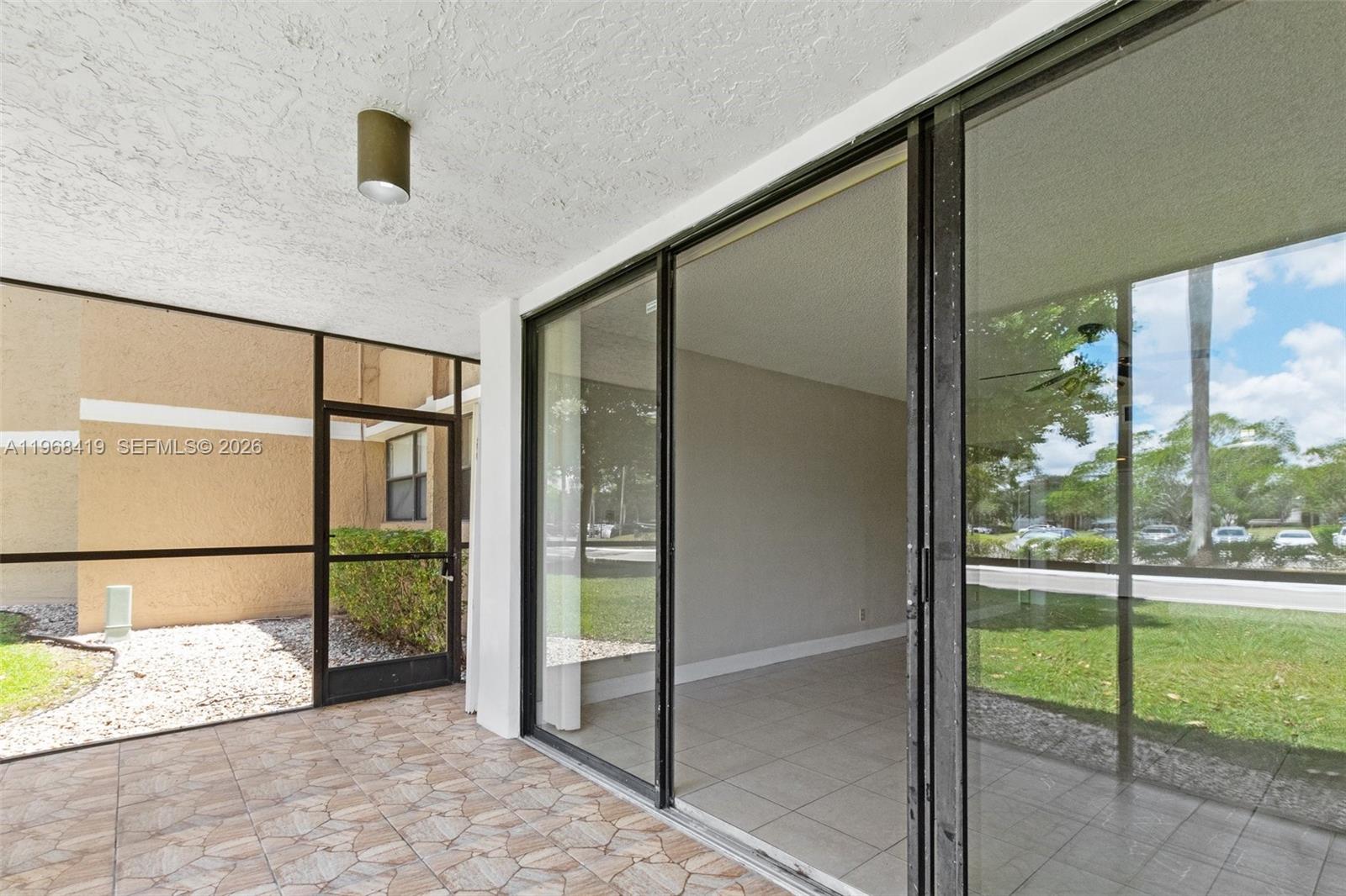 16400 Golf Club Road, Unit 104 Weston, FL 33326 - Photo 23 of 24 a balcony view with a glass door