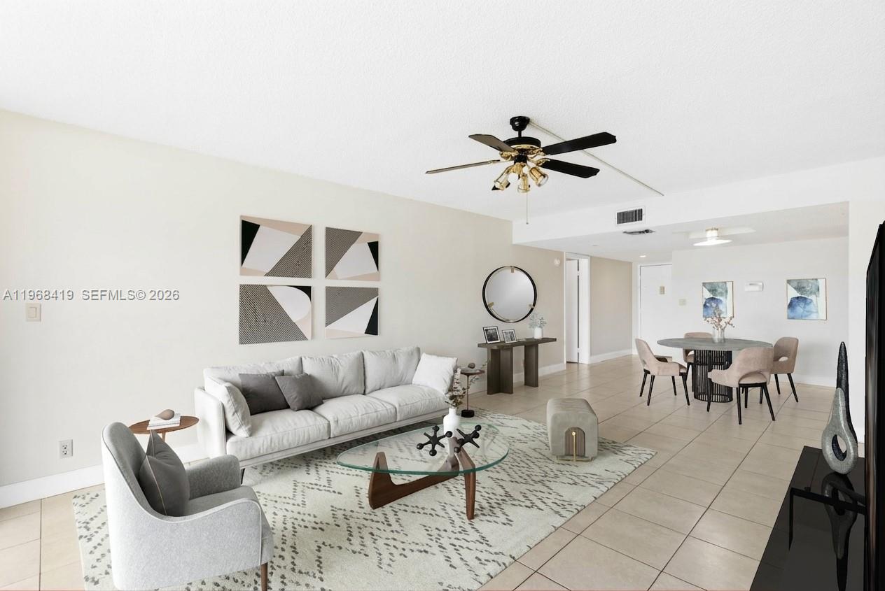 16400 Golf Club Road, Unit 104 Weston, FL 33326 - Photo 6 of 24 a living room with furniture a rug and a window