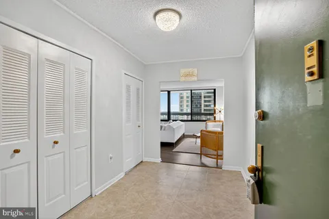 a view of a dining room with furniture and window