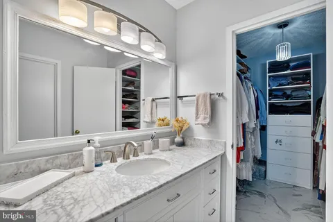 a bathroom with a shower and a sink