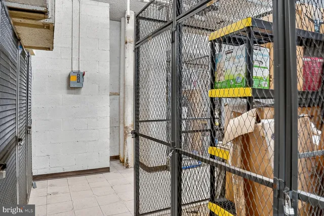 a living room with fireplace furniture and a dining table with wooden floor
