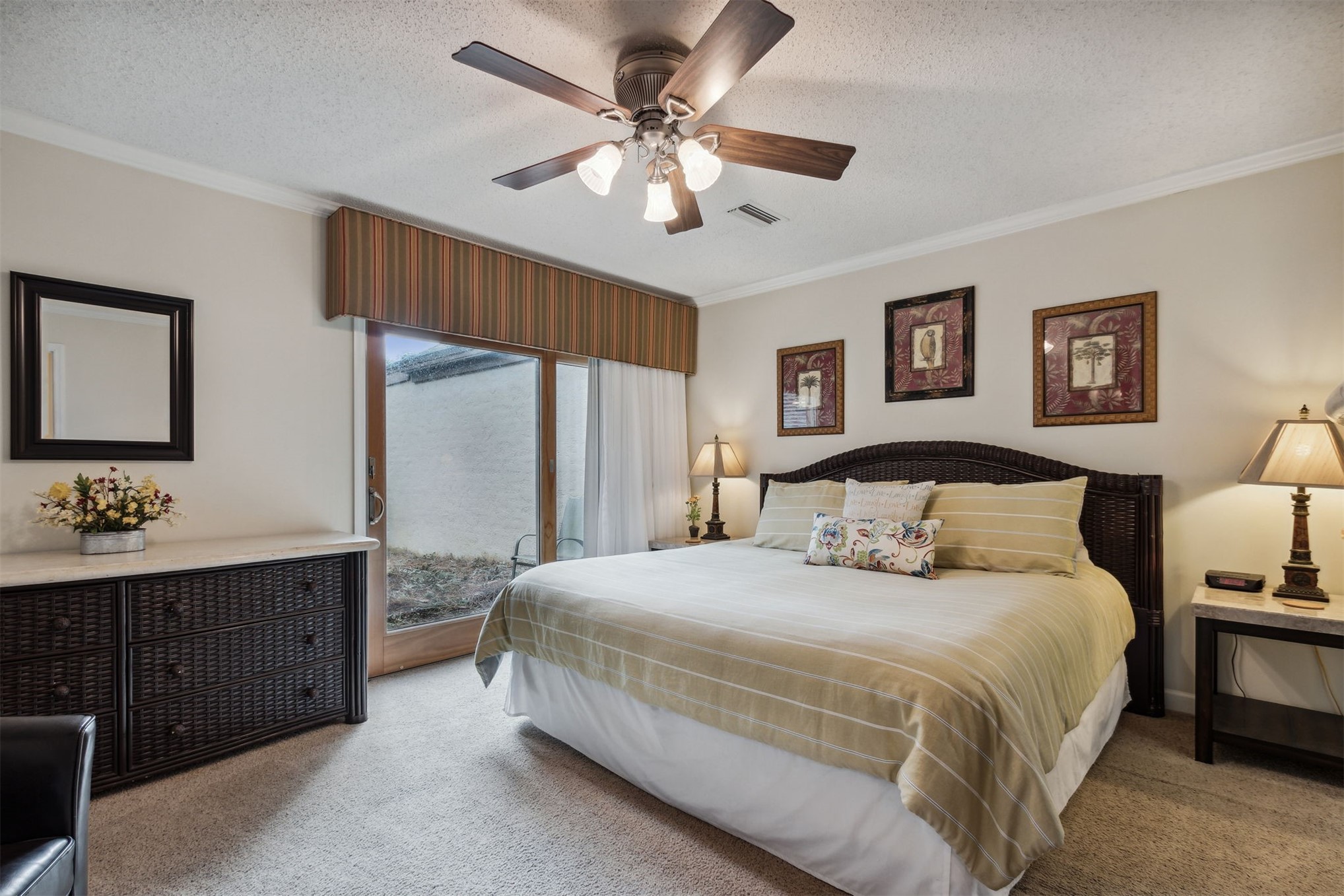 3327 Sea Marsh Road, Unit 3327 Fernandina Beach, FL 32034 - Photo 16 of 39 a bedroom with a large bed and a chandelier
