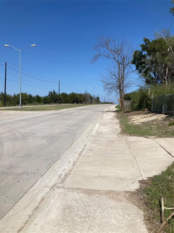 3710 Telephone Road Dallas, TX 75241 - Photo 16 of 32 View of road with curbs, street lighting, and sidewalks