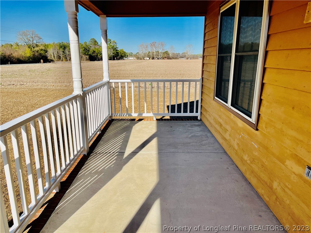 3140 Wade-Stedman Road Stedman, NC 28391 - Photo 3 of 36 a view of balcony with wooden floor