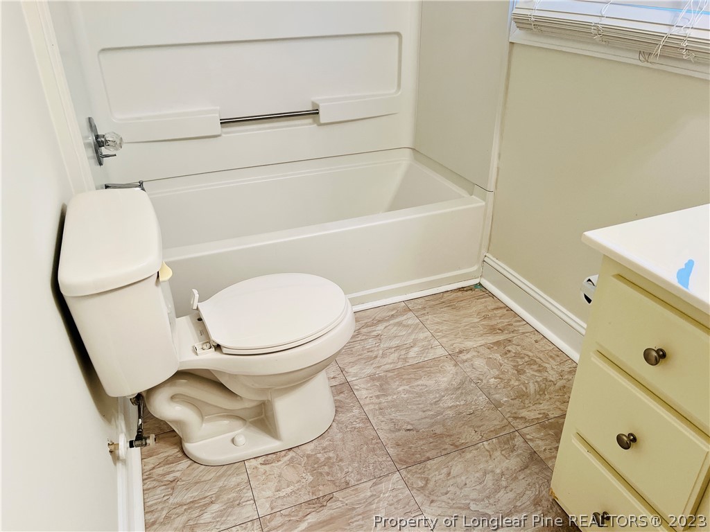 3140 Wade-Stedman Road Stedman, NC 28391 - Photo 34 of 36 a bathroom with a toilet and a shower