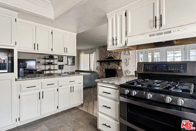 a living room with furniture and garden view