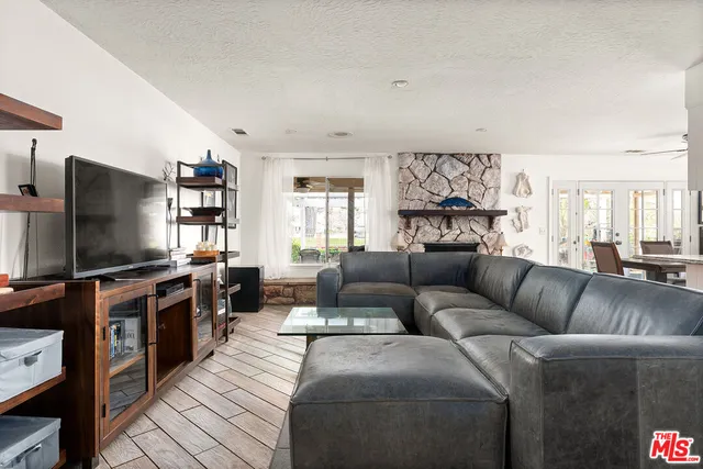 a kitchen with white cabinets and appliances