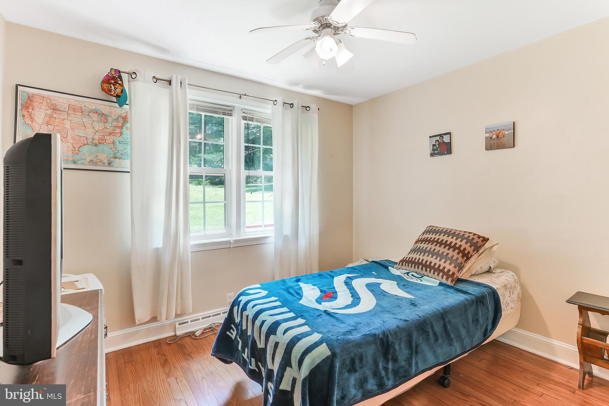 430 West Rose Tree Road Media, PA 19063 - Photo 22 of 31 a bedroom with a bed and wooden floor