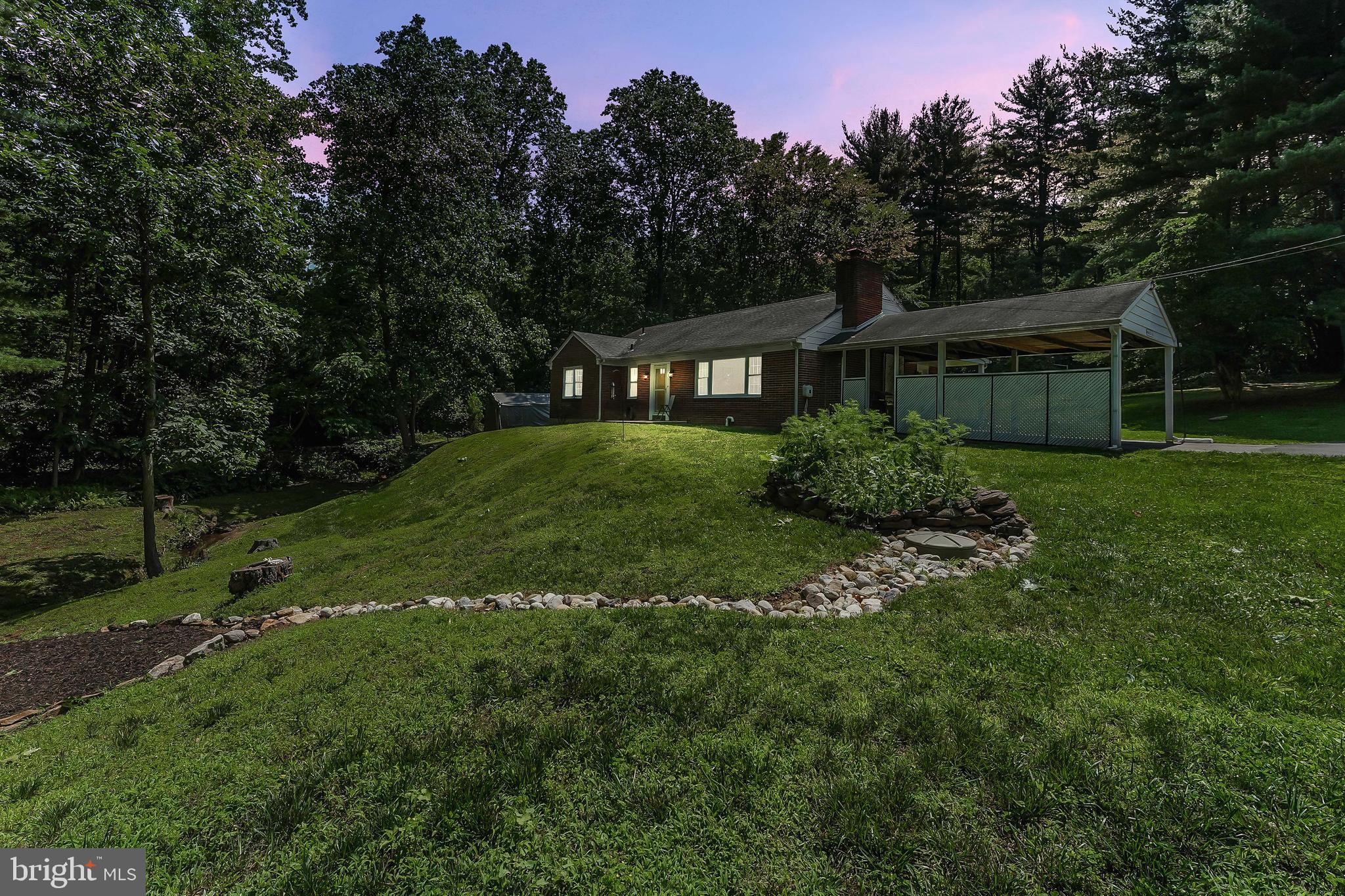 430 West Rose Tree Road Media, PA 19063 - Photo 28 of 31 a front view of a house with a garden