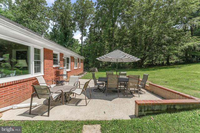 a patio with table and chairs