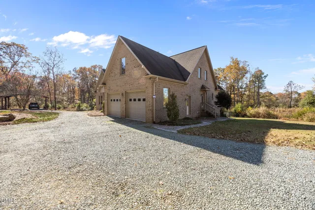 a view of a house with snow on the road