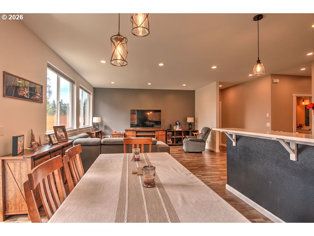 1966 34th Street Florence, OR 97439 - Photo 5 of 17 a living room with furniture kitchen view and a large window
