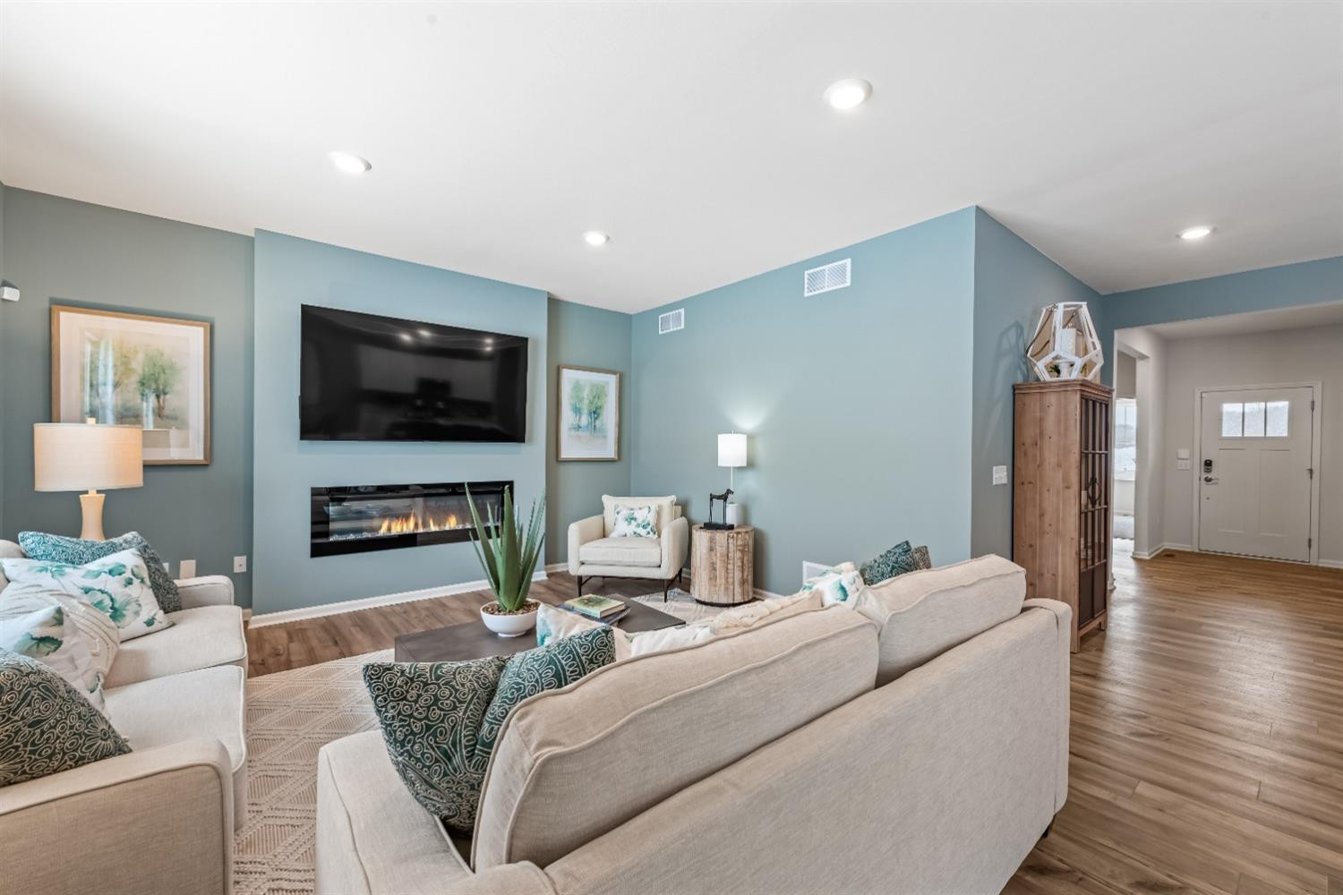 8553 Graystone Drive Lowell, IN 46356 - Photo 11 of 27 a living room with furniture and a flat screen tv