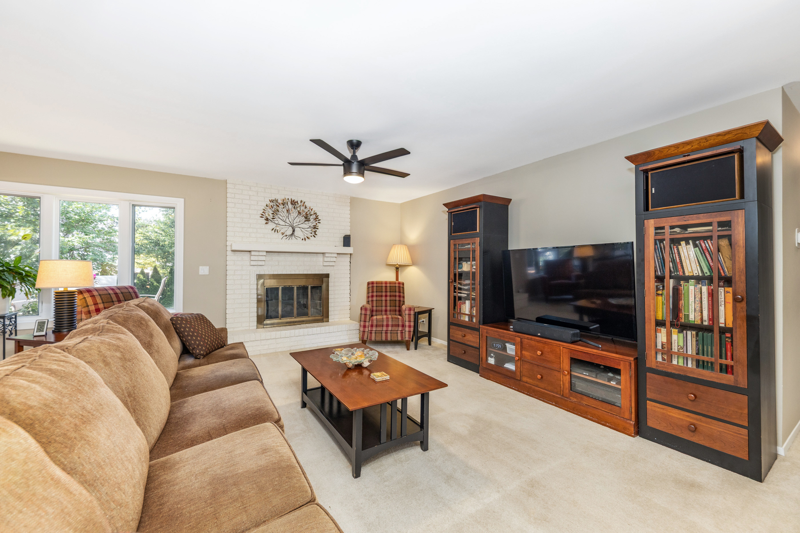 1505 Ranchview Drive Naperville, IL 60565 - Photo 11 of 36 a living room with furniture flat screen tv and a fireplace