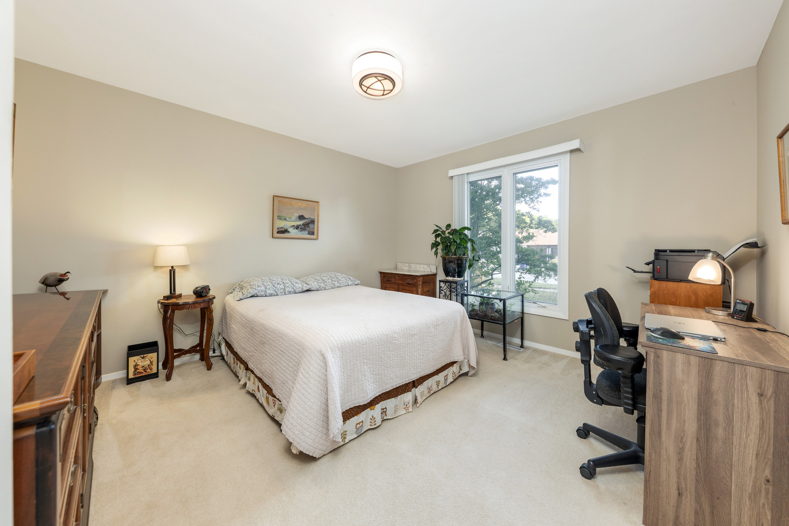 1505 Ranchview Drive Naperville, IL 60565 - Photo 19 of 36 a bedroom with a bed and a desk