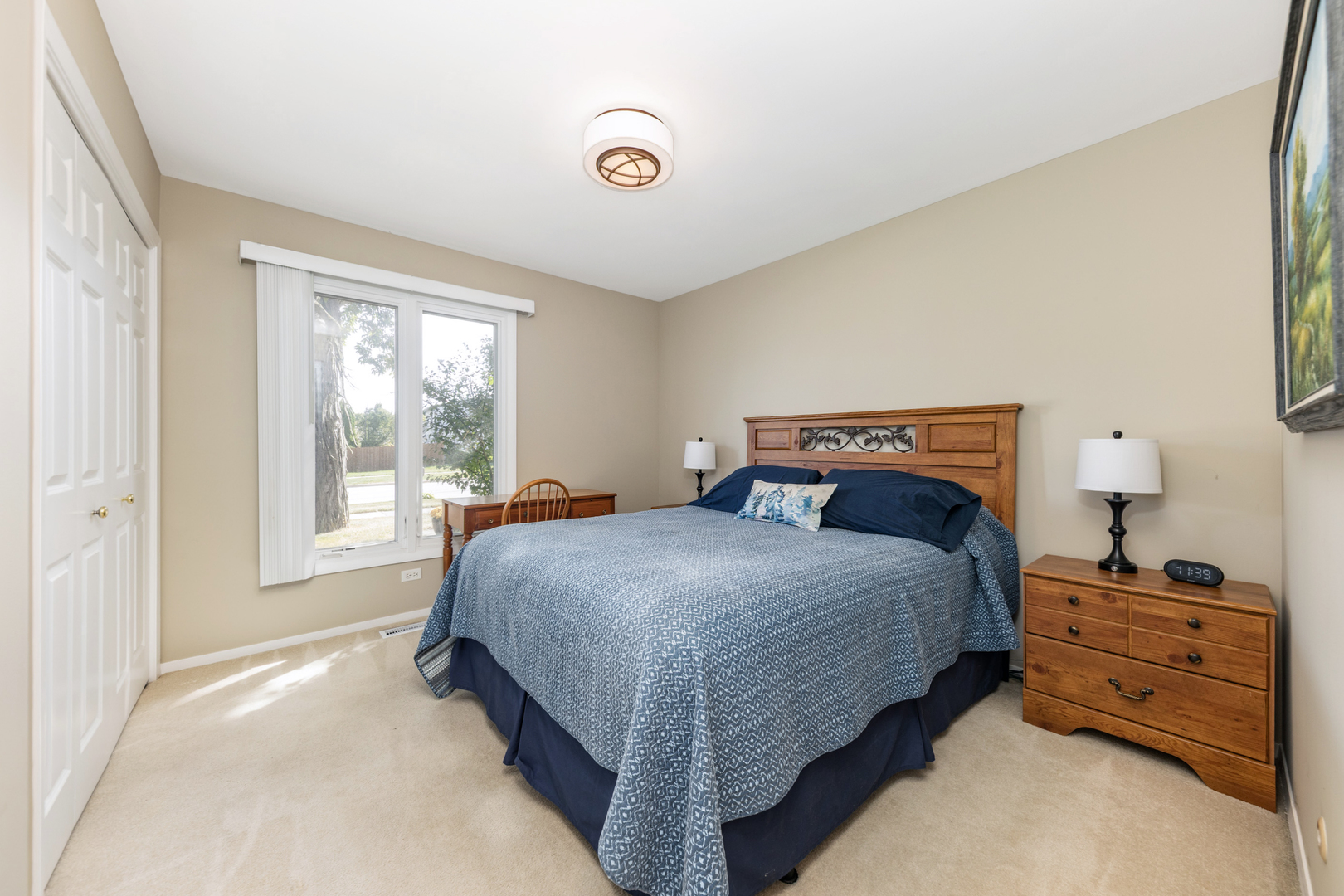 1505 Ranchview Drive Naperville, IL 60565 - Photo 20 of 36 a bedroom with a bed and a window
