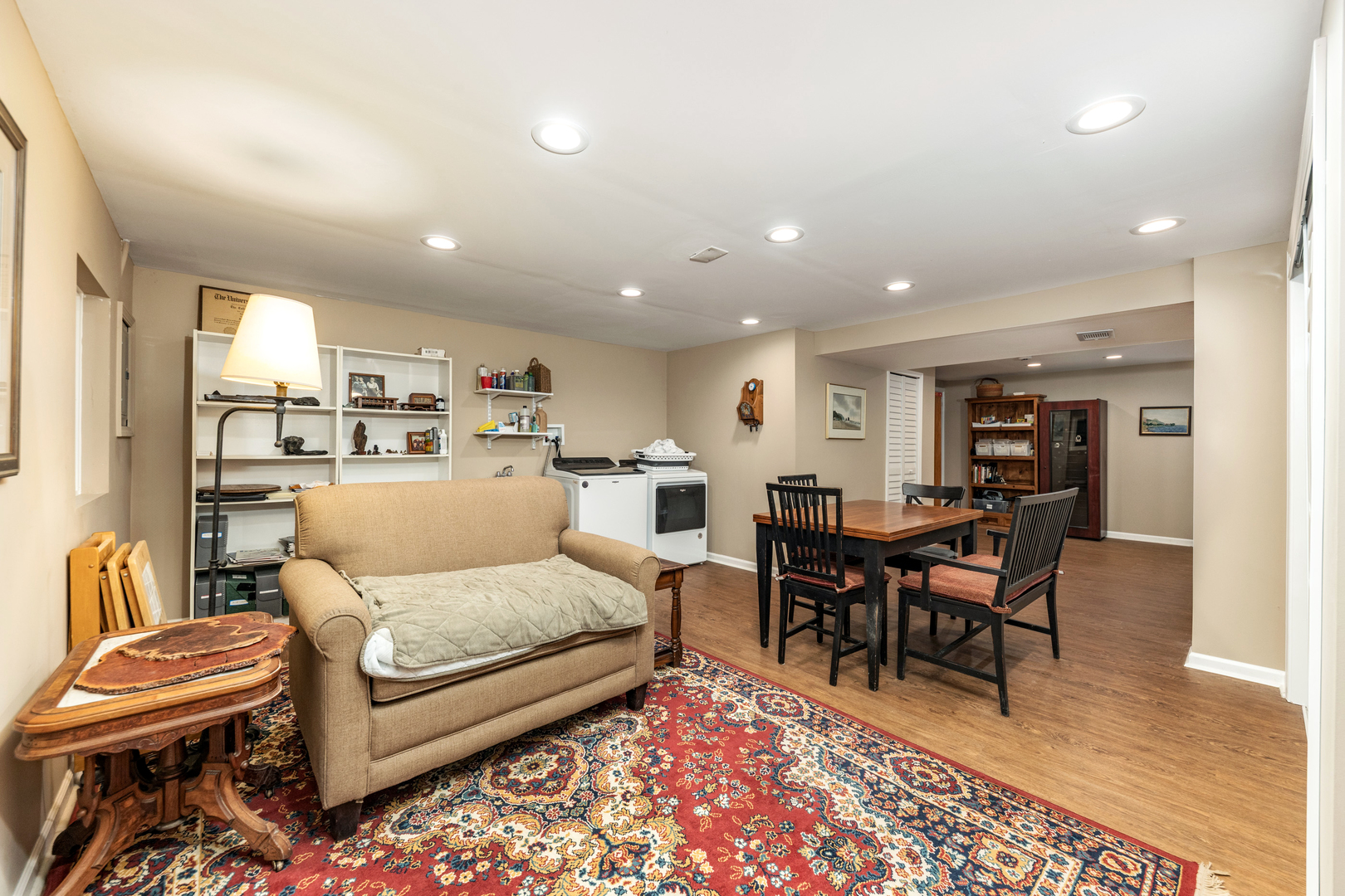 1505 Ranchview Drive Naperville, IL 60565 - Photo 23 of 36 a living room with furniture a dining table and kitchen view