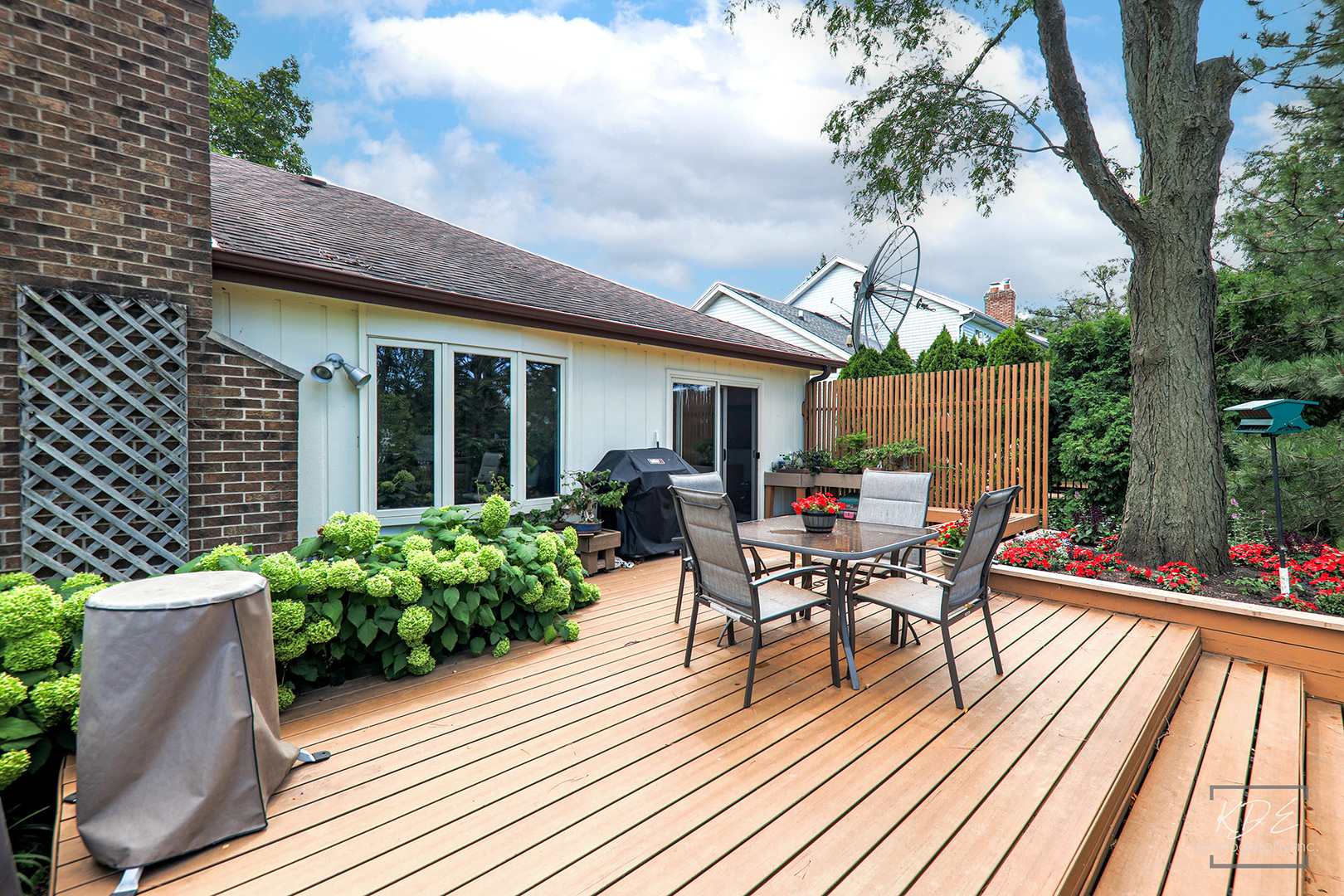 1505 Ranchview Drive Naperville, IL 60565 - Photo 28 of 36 a view of a patio with table and chairs potted plants and large tree