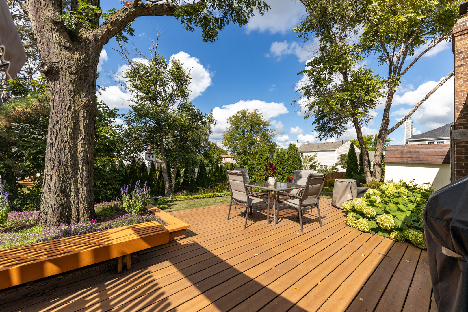 1505 Ranchview Drive Naperville, IL 60565 - Photo 4 of 36 a view of a balcony with chairs and wooden floor