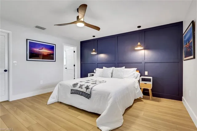 a bathroom with a shower sink and mirror