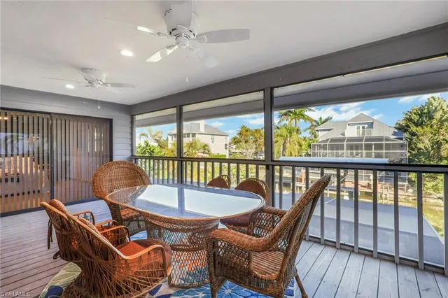 a bedroom with a bed and large flat tv screen