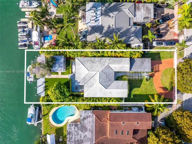 a bedroom with furniture and a large window