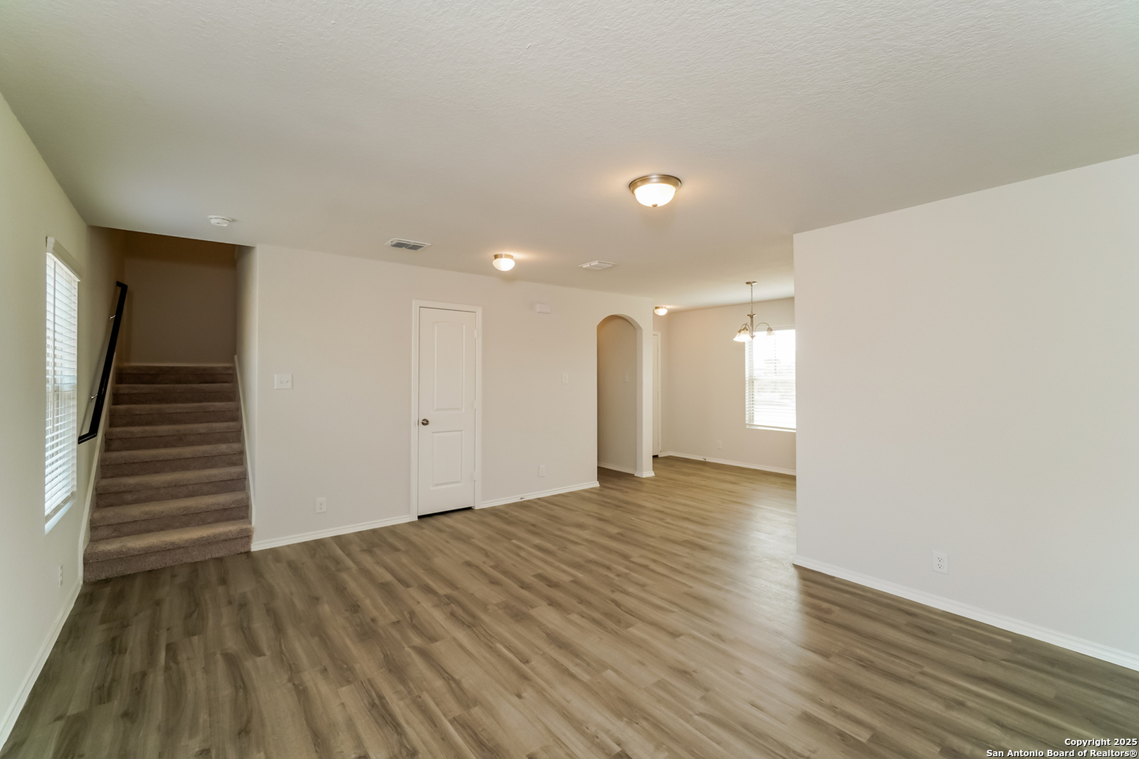 5011 Blue Ranch San Antonio, TX 78222 - Photo 5 of 15 a view of an empty room with wooden floor
