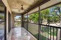 9731 West McNab Road, Unit 208 Tamarac, FL 33321 - Photo 11 of 13 a view of a porch with a floor to ceiling window