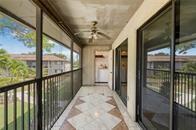 9731 West McNab Road, Unit 208 Tamarac, FL 33321 - Photo 10 of 13 a view of a porch