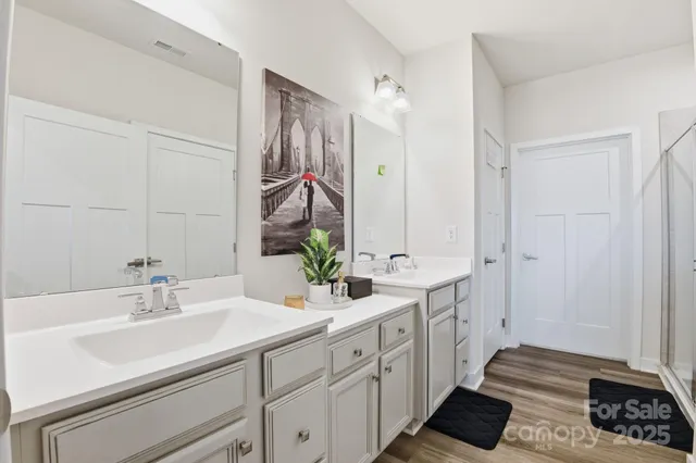 a bedroom with two beds and a window