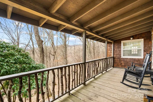 a view of balcony with wooden floor