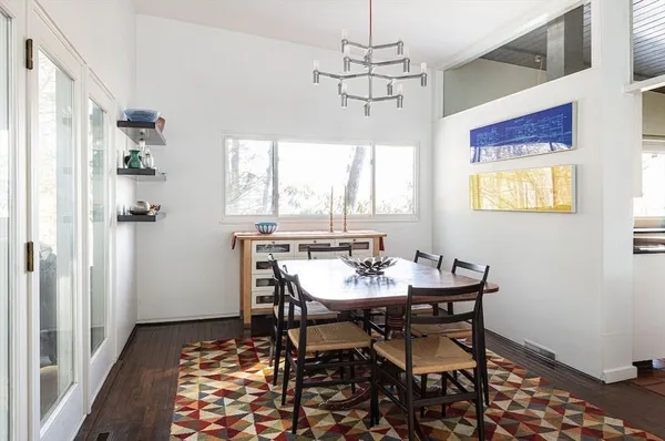 a view of a dining room with furniture window and wooden floor