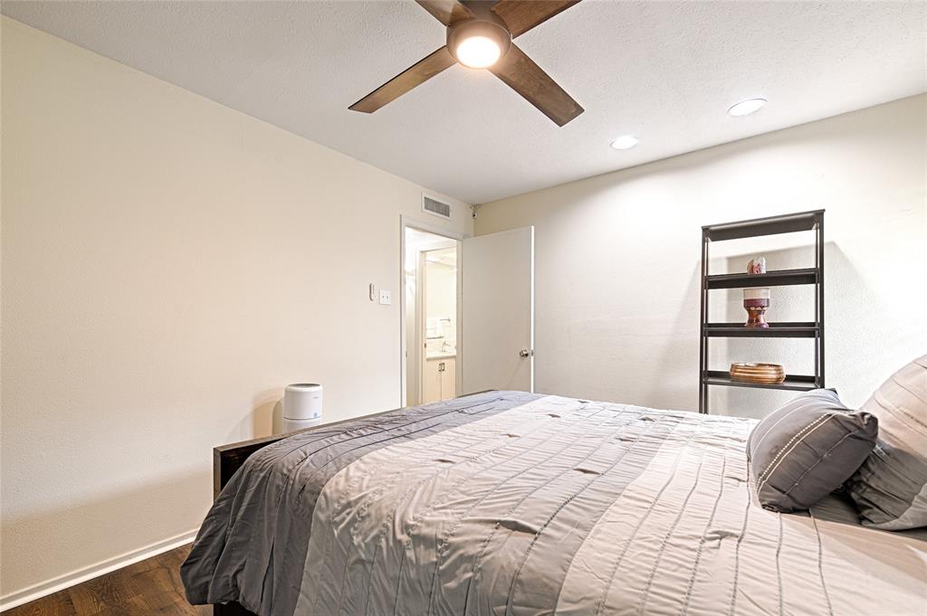 10757 Villager Road, Unit D Dallas, TX 75230 - Photo 17 of 21 a bedroom with a bed and a window