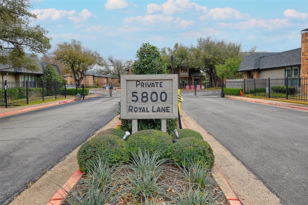 10757 Villager Road, Unit D Dallas, TX 75230 - Photo 21 of 21 a view of a street with benches in the background