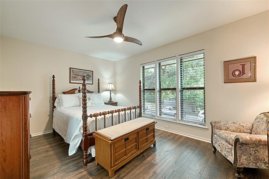 10757 Villager Road, Unit D Dallas, TX 75230 - Photo 3 of 21 a bedroom with furniture and wooden floor